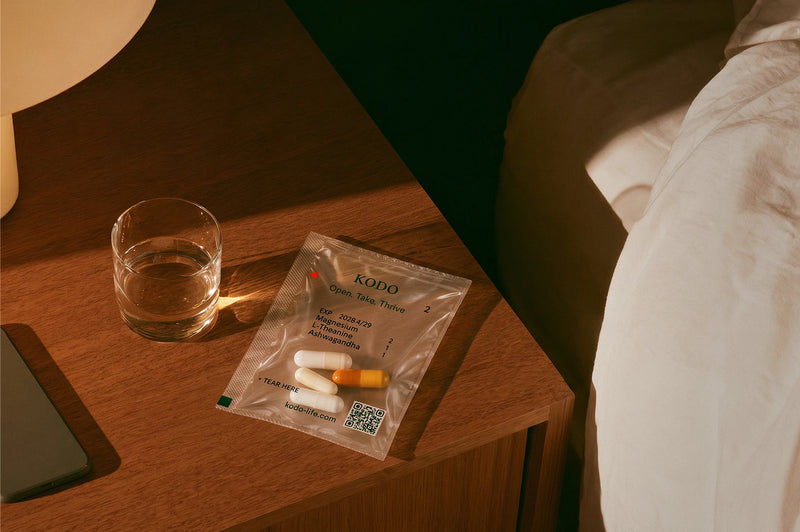 A Night Pack sachet on a bedside table